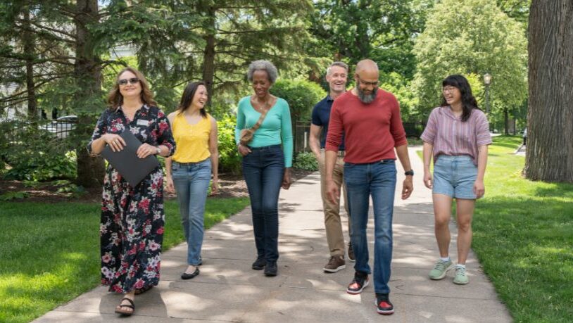 A group of people enjoying the Irvine Parking walking tour.