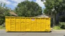 The big yellow dumpster in front of Mr. Positive's house.