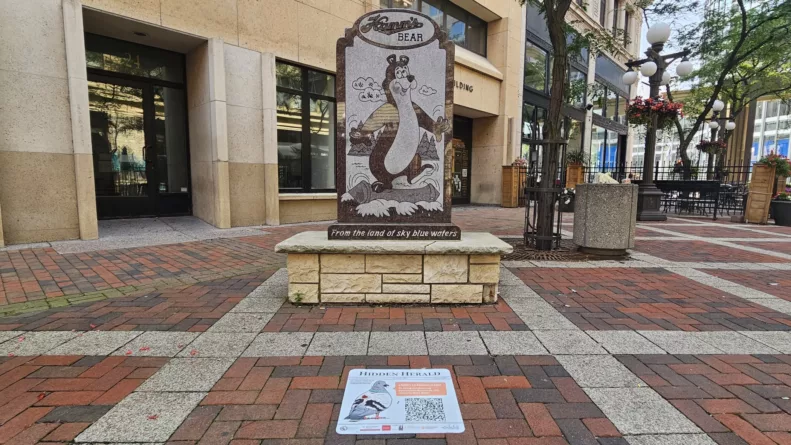 A Hidden Herald play located near the Hamms statue on West 7th Pl.