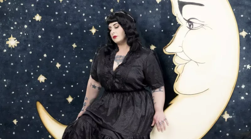 Davina Sowers rests on a sliver of the moon.