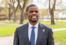 St. Paul Mayor Melvin Carter smiling in a park.