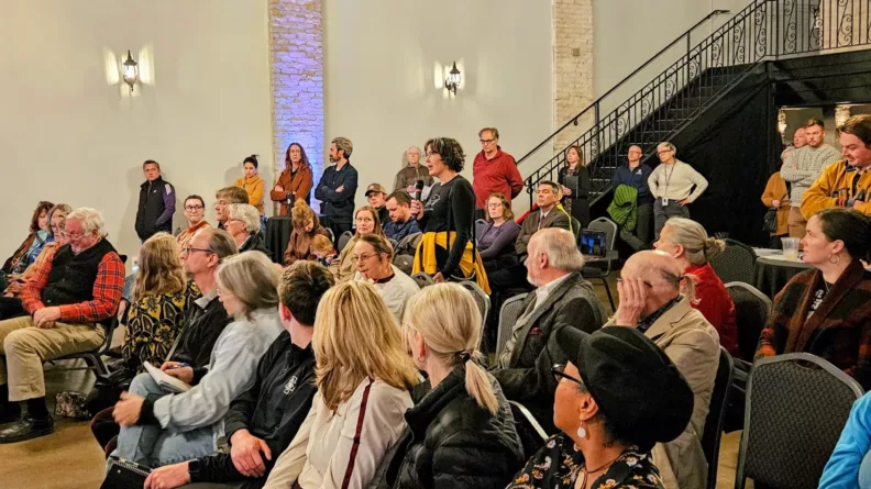 West 7th resident Dana DeMaster asks a question at the Future of West 7th event on October 29, 2025.