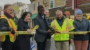 Mayor Melvin Carter cuts the construction tape to reopen Grand Avenue on October 21. Photo Courtesy Macalester-Groveland Community Council.
