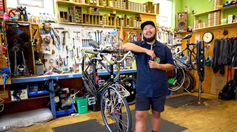 An employee repairs a bicycle at Express Bike Shop in St. Paul.