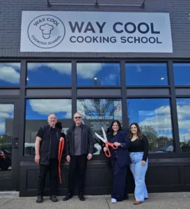 The Way Cool Cooking School team cut the ribbon on their second location on May 1. Credit: Damian Goebel